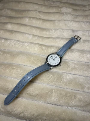 Ny klocka ljusblå silver - Ny justerbar klocka med plombering kvar