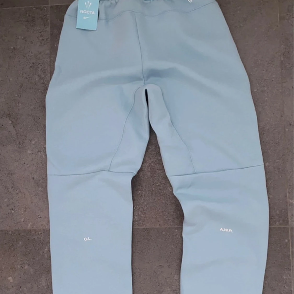 Nike NOCTA ljusblå mjukisbyxor S - 1