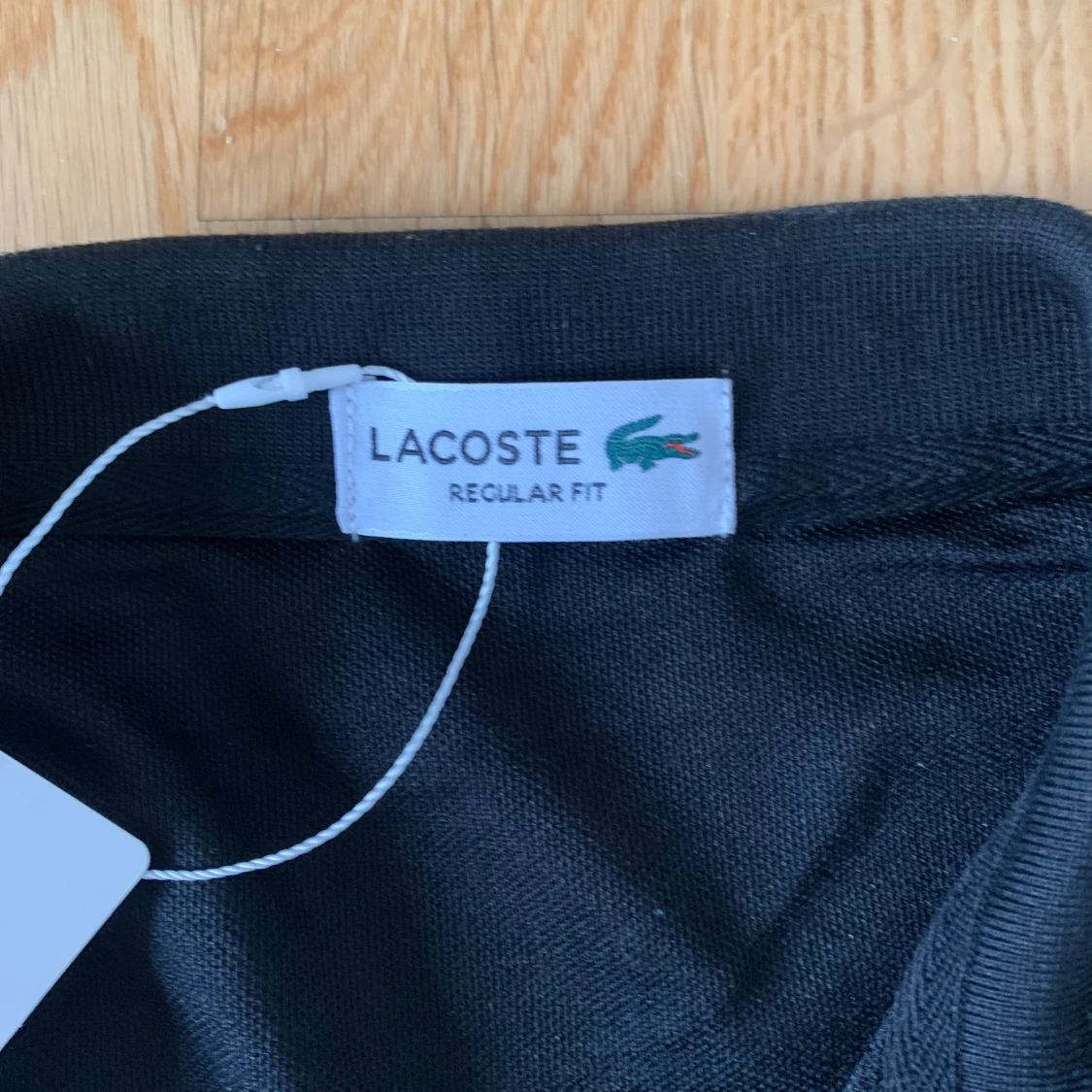Lacoste svart piké  - 1