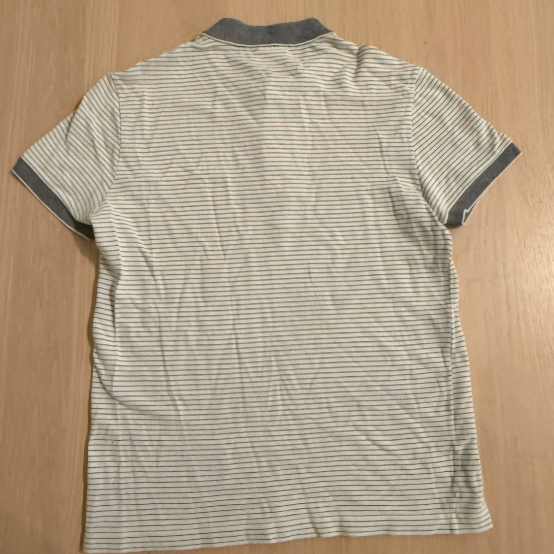 Randig pikétröja från Lacoste - 1