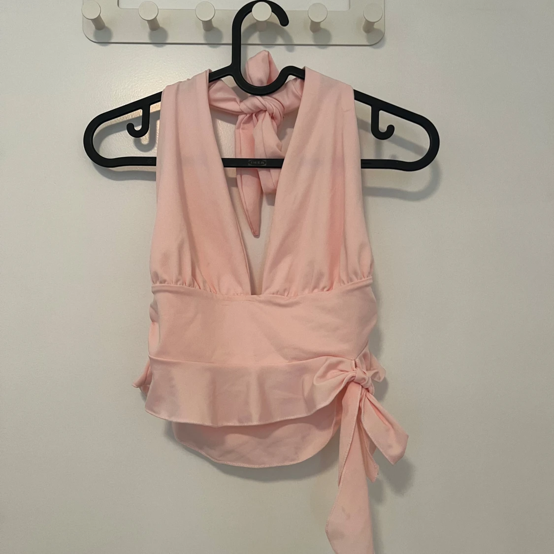 Ljusrosa omlottopp med knyt