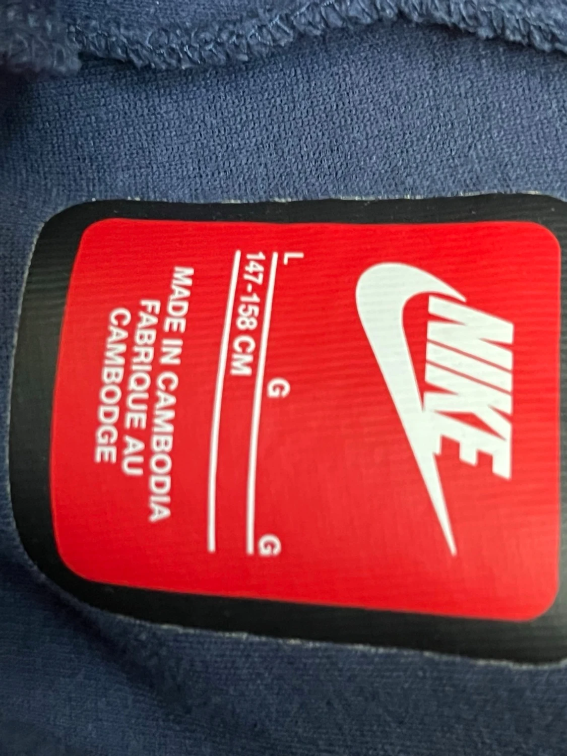 Två färgade Nike tech byxor - 1