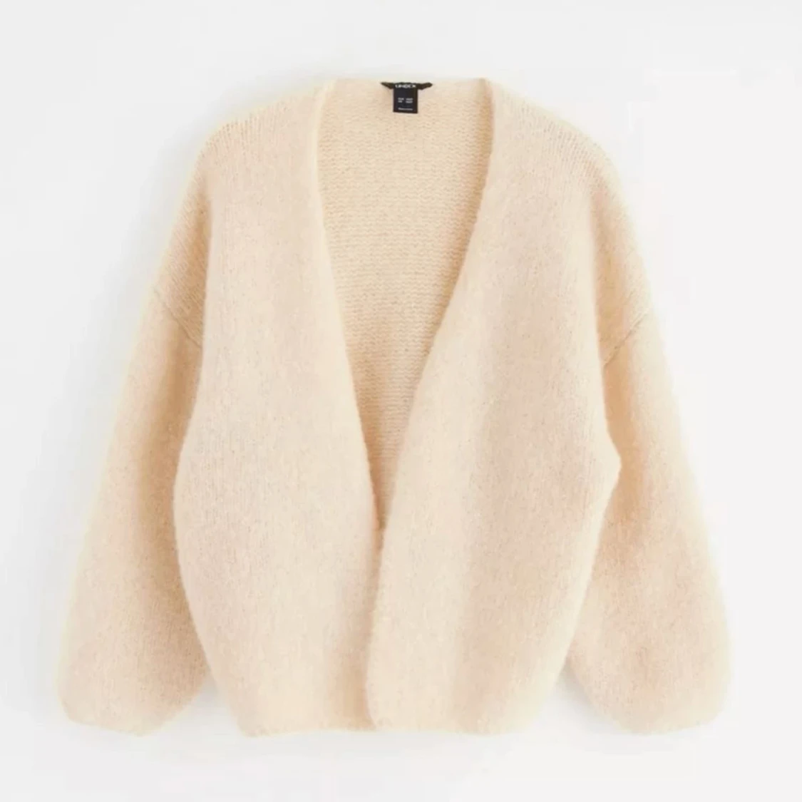 Beige fluffig kofta från Lindex 