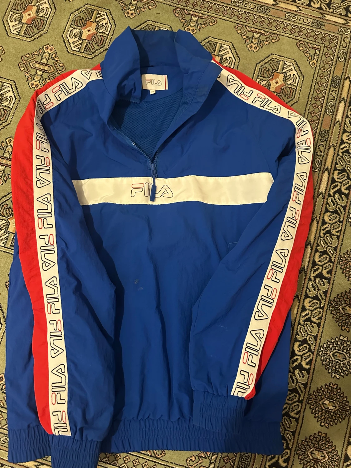 Blå FILA vindjacka med half zip XS