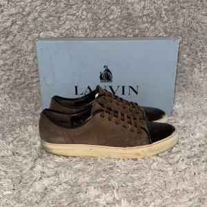 Lanvin sneakers - | Condition: 6/10 | Color: Brown, White and black | What is included: Box and sneakers | Retail price: 5 200kr |
