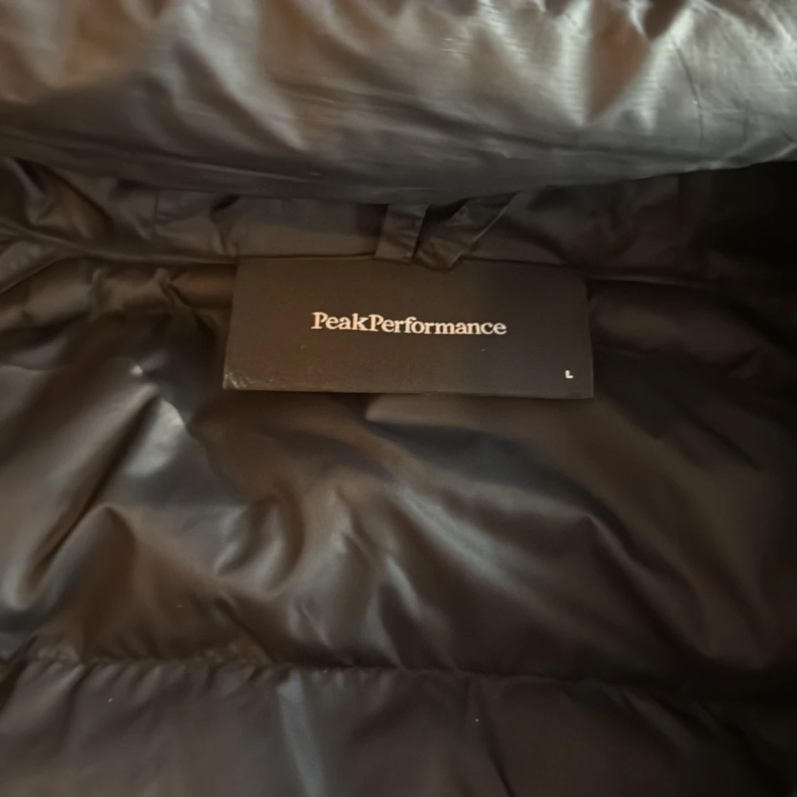 Svart dunjacka Peak Performance L - 1