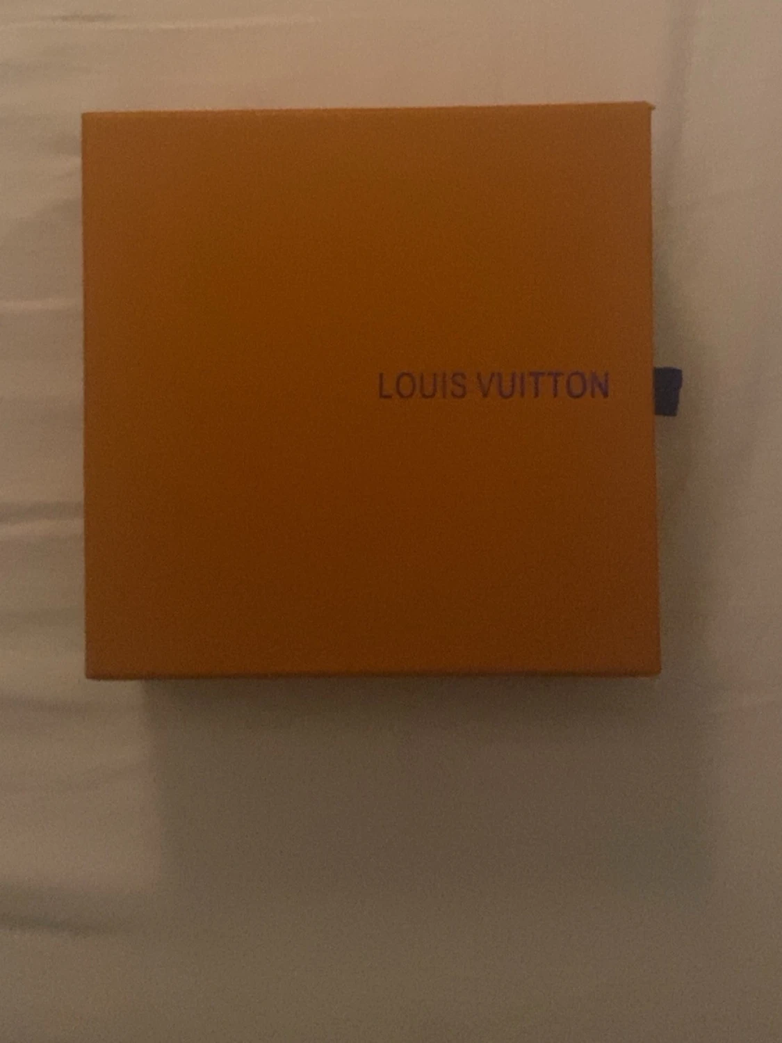 L V bälte i originalask