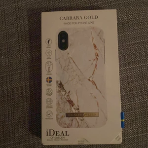 iDeal of Sweden skal  - Skalet heter Carrara gold och är för iPhone X/XS och använd få tal gånger ganska bra skick bara lite repor