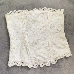 Korset Gina Trico  - Storlek: S/M.  Plaggets längd 33cm, 37cm bredd. Betalningsmetod: Swish. Frakt tillkommer postnord blå påse 45kr