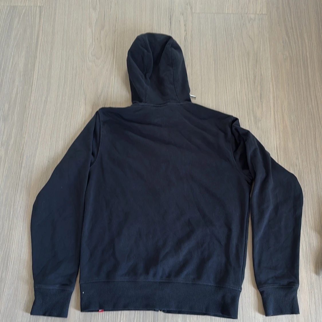 Svart zip up från New Balance S - 1