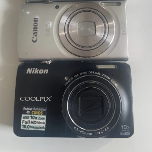 Digitala kameror  - Bilderna visar två digitalkameror: Canon IXUS 175 och Nikon Coolpix S6300. Använda men i jätte jätte bra skick. Kanske en eller två repot på kameran men inte på linsen. Den svarta för:2500 och den silvriga för: 1600 pris kan  diskuteras!