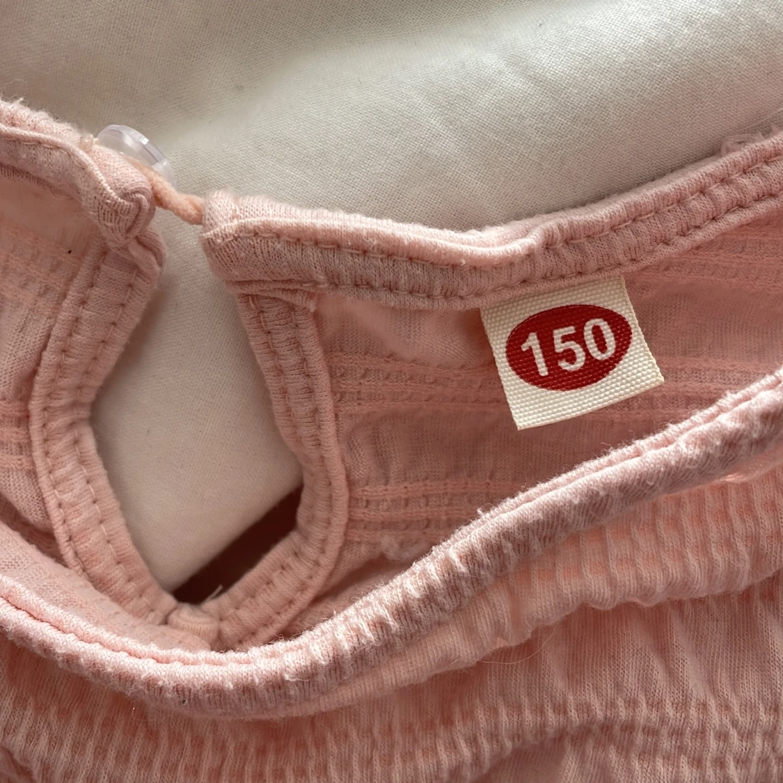 Ljusrosa blus med strukturmönster - 1