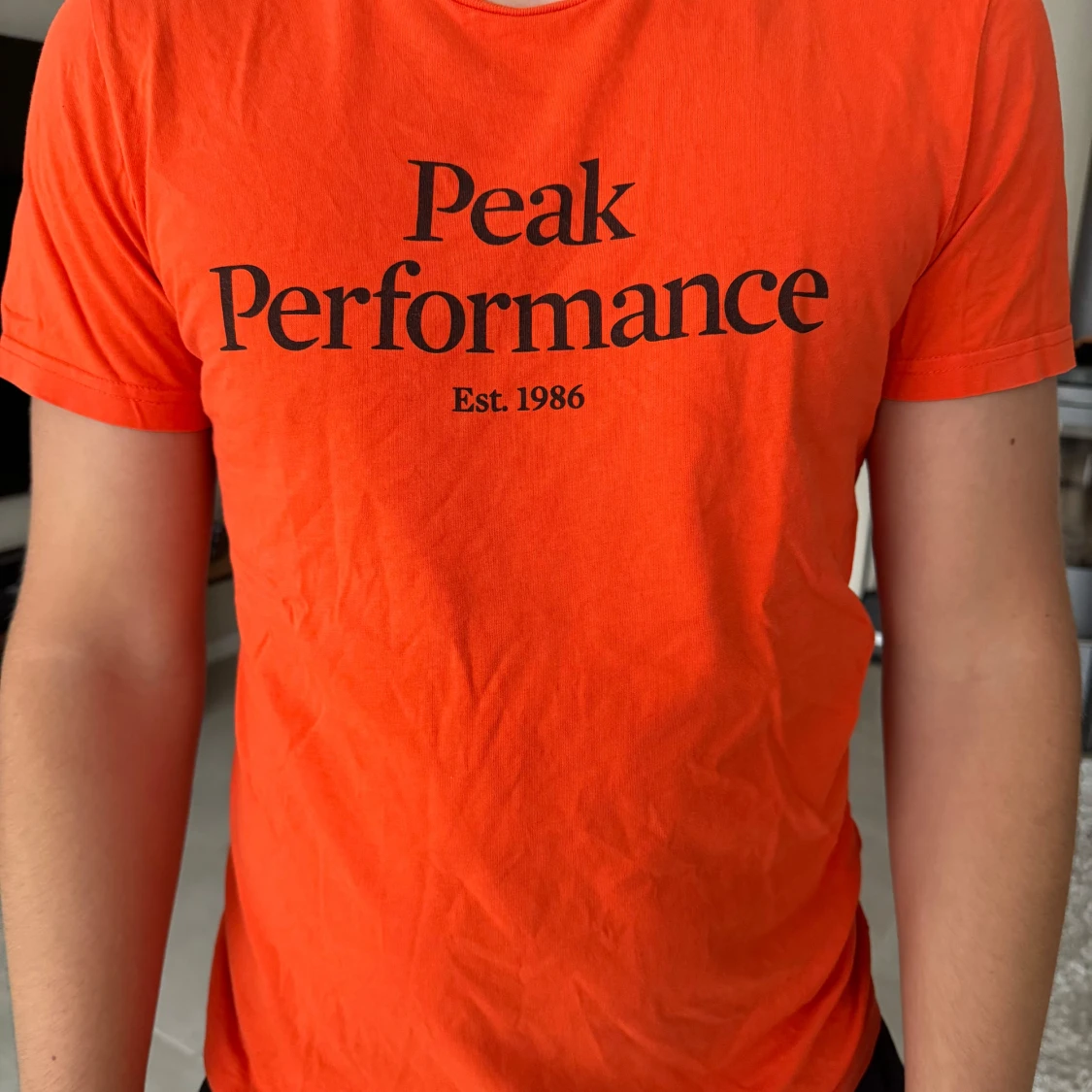 Orange t-shirt från Peak Performance
