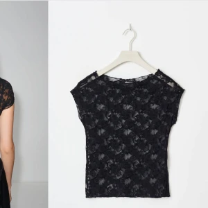Svart spetsblus - Elegant svart spetsblus med korta ärmar och ett vackert blommigt mönster. Helt oanvänd med prislappen kvar! 