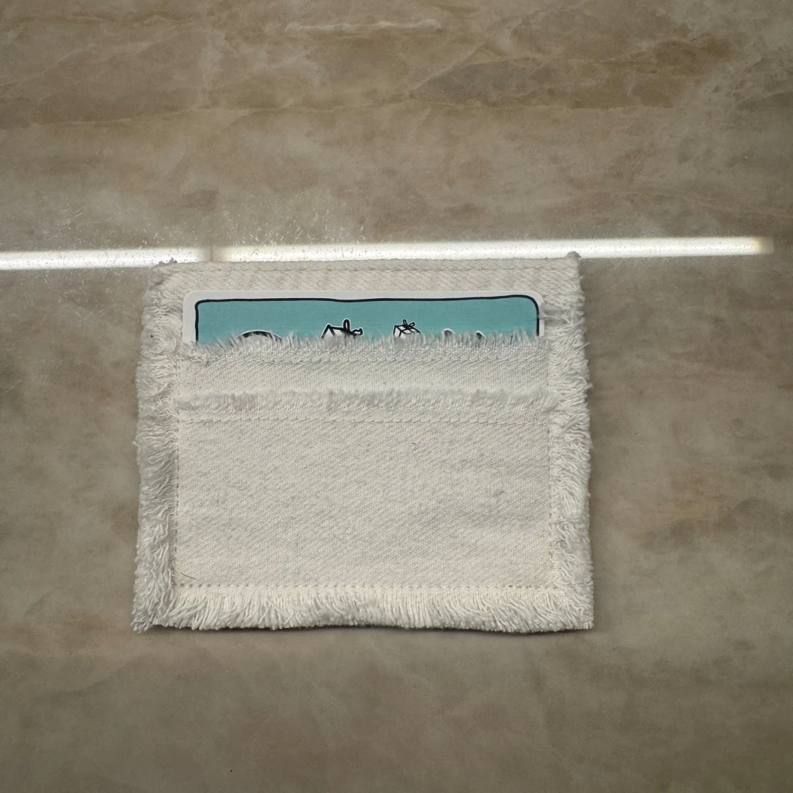 Vit jeanskorthållare