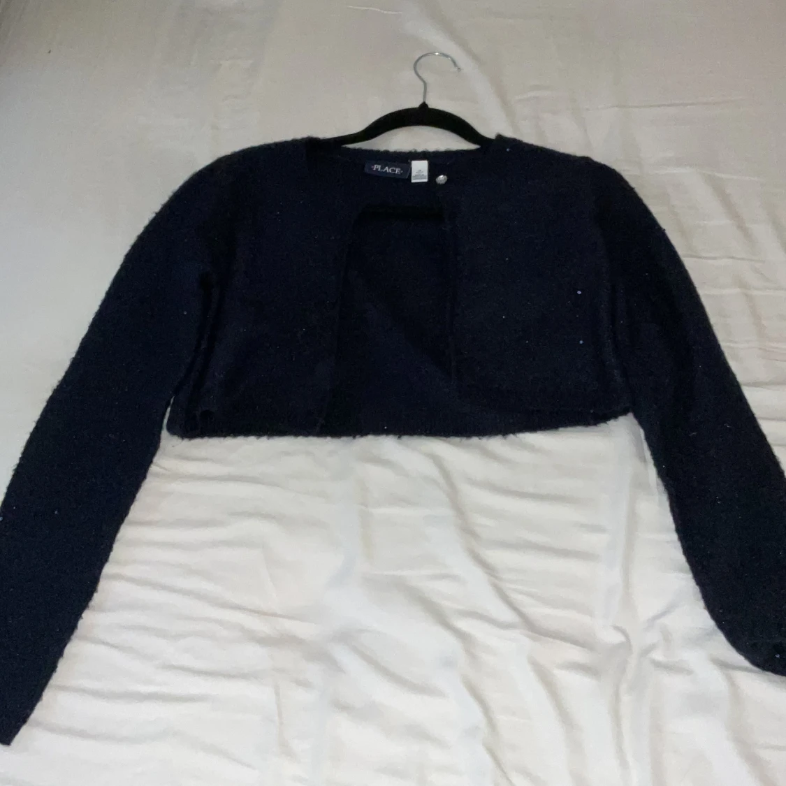 Mörkblå glittrig bolerotopp från Place