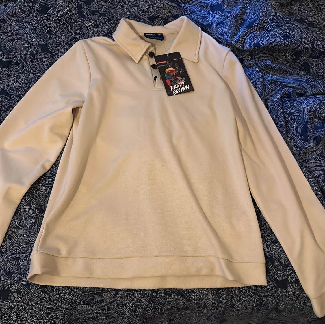 Beige pikétröja från Harry Brown