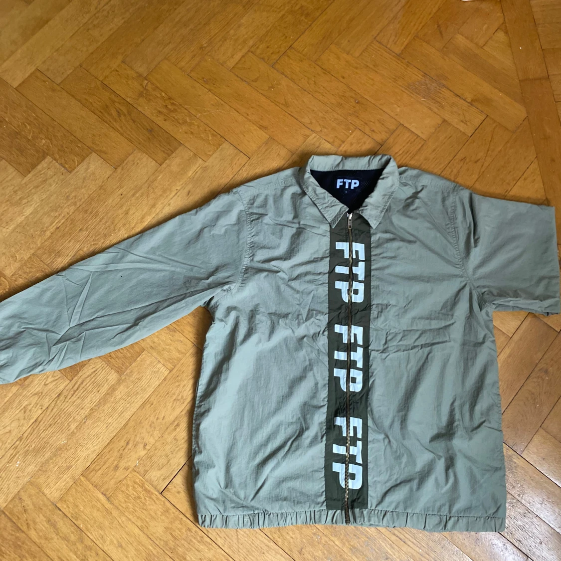 FUCKTHEPOPULATION Wind Breaker Large