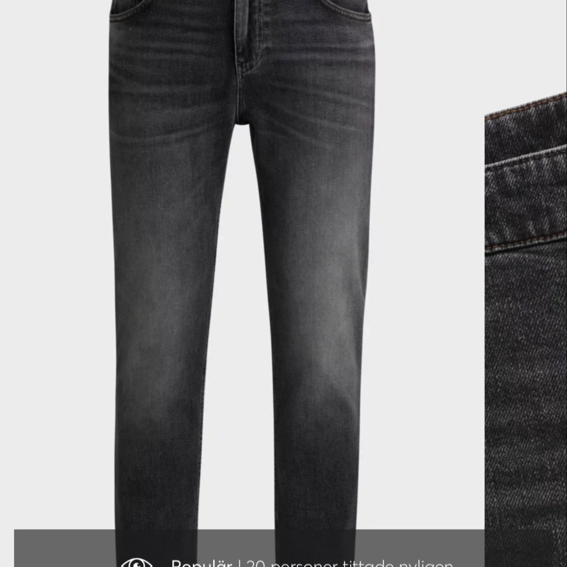 Svarta jeansbyxor med dragkedja