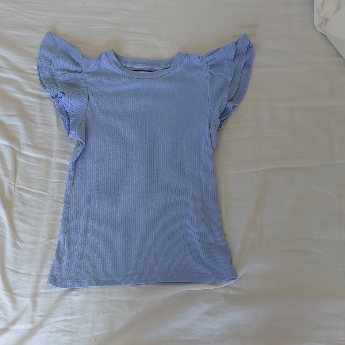 Ljusblå topp från Holly & Whyte