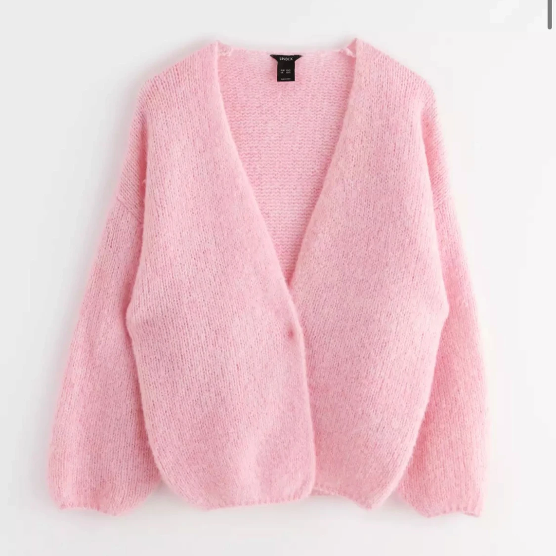 Rosa stickad kofta från Lindex