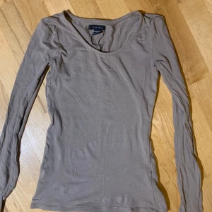 Tight långarmad  top - Andvänd fåtalgånger 