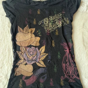 Christian audigier - Jätte snygg tröja med coola tryck Stl är L men sitter som Xs/s