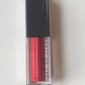 Metallic liquid lipstick Make up store  - Oöppnad Metallic liquid lipstick från Make up store. Icon. 