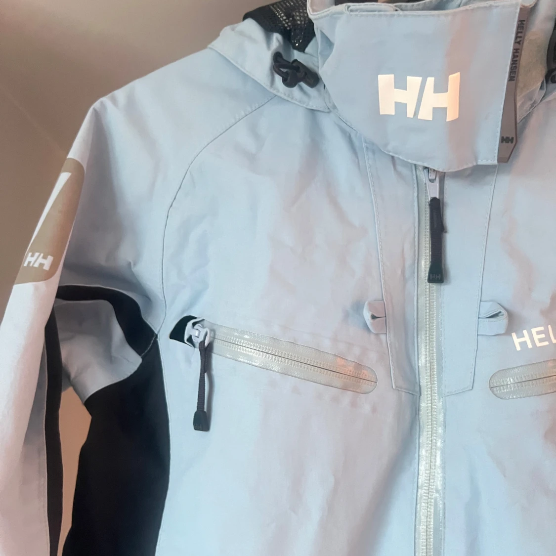 Ljusblå Helly Hansen jacka - 1