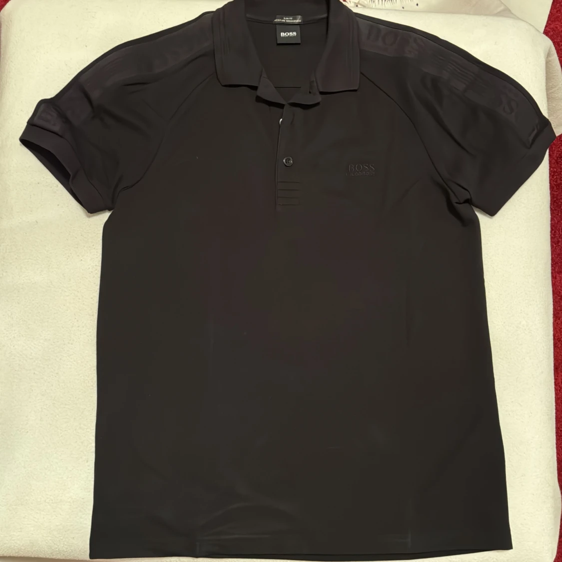 Svart pikétröja från Hugo Boss