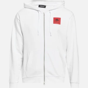 Vit hoodie från Replay - Snygg vit hoodie från Replay med dragkedja och en röd detalj på bröstet. Tröjan har en klassisk passform med långa ärmar och en praktisk ficka framtill. Perfekt för en avslappnad stil. Säljer pga att den var för stor. Priset går att diskutera vid snabb affär.