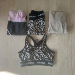 Tränings kläder  - Säljer tre super snygga tights och en sport bh. Den beiga byxorna är från bikbok säljer dem för 150 kr. Gavelio tightsen säljer jag för 250 och stronger tightsen och sport bh säljs tillsammans för 300 spänn. Du kan få allt för 500 kr. Fråga på! 
