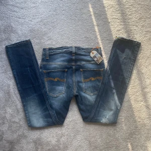 Nudie jeans - Ett par sjukt snygga Nudie Jeans med slitningar och en grymt snygg tvätt❗️| Modell: Thin Finn - Slim fit👖| Skick:10/10 (NYA)✅| Hör av er vid ytterligare frågor❗️
