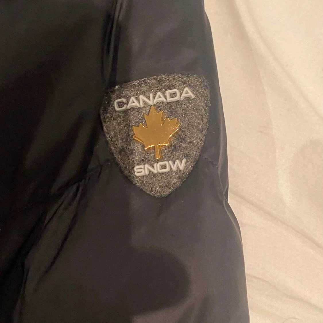 Svart dunjacka från Canada Snow - 92