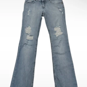 lågmidjade jeans med hål - Från lee 