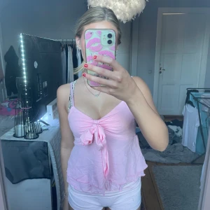 Rosa linne med en roset - bra skick,bara använt en gång