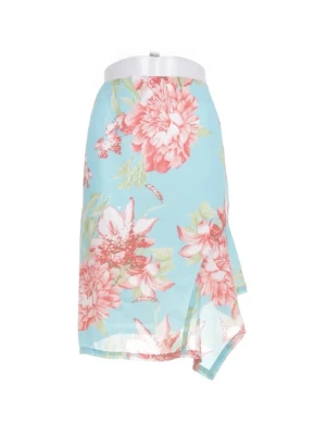 Blommig asymmetrisk kjol -  jättefin asymmetrisk midi kjol från Maria Westerlind i en somrig turkos färg med rosa korallfärgade blommor.  Storleken är 36, men passar XS-M