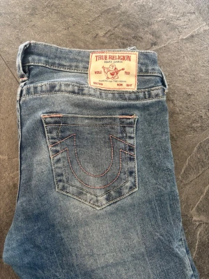 True Religion jeans  - Säljer ett par ultra low waist flare jeans ifrån Nelly i strl W28❣️