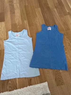 Två linnen Kappahl  - Två stycken linnen från Kappahl i storlek 128. Fint skick