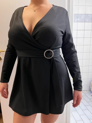 Svart jumpsuit - En svart långärmad jumpsuit