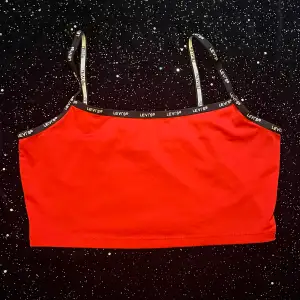 cute red levi’s tank top, never really worn it, in brilliant condition 
