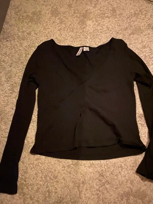 Tajt tröja - Storlek L sitter som S