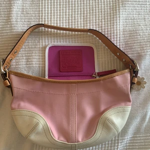 Coach small hobo shoulder bag - Hobo shoulder pink and white canvas/white leather bag. Model number L3J-4431 daisy collection. Like new condition, with both silver and leather daisy pendant. Size 28cm wide by 15cm tall(without strap). Strap is adjustable and reversible. Perfect addition for summer outfits.