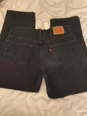 LEVIS JEANS - Svarta jeans från Levis, 550. W 36 L 30