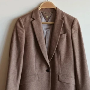 Blazer wool  - Measurements: shoulder to shoulder 38 cm and sleeve length 56 cm. It's size XS-S maybe, for short girl. It's made with wool (74%)