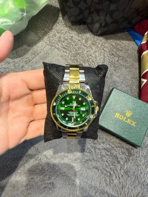 Rollie green, silver & Gold - Unused, brand new and fresh. Please feel free to ask questions.