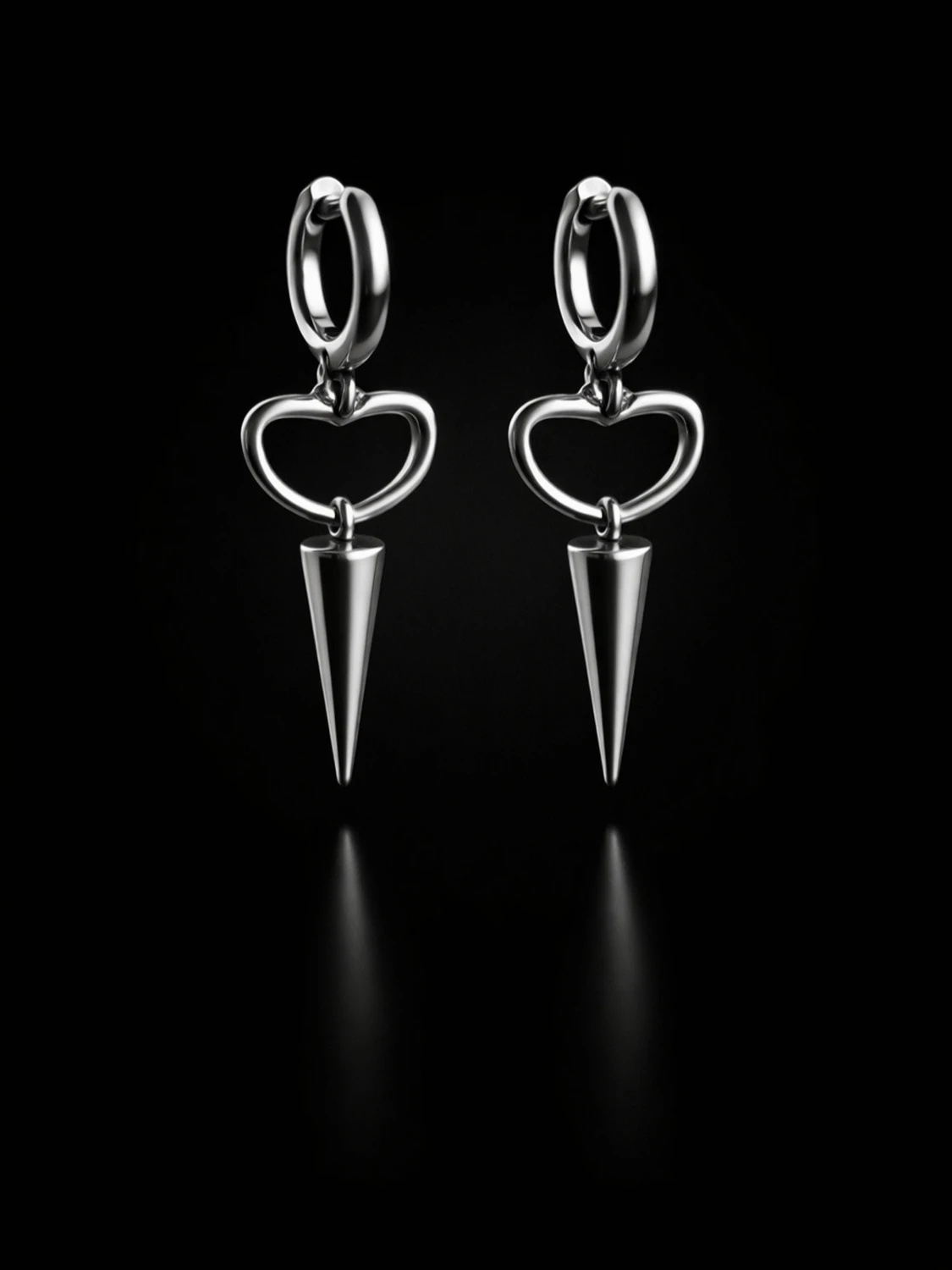 Silvriga örhängen med hjärta och kon