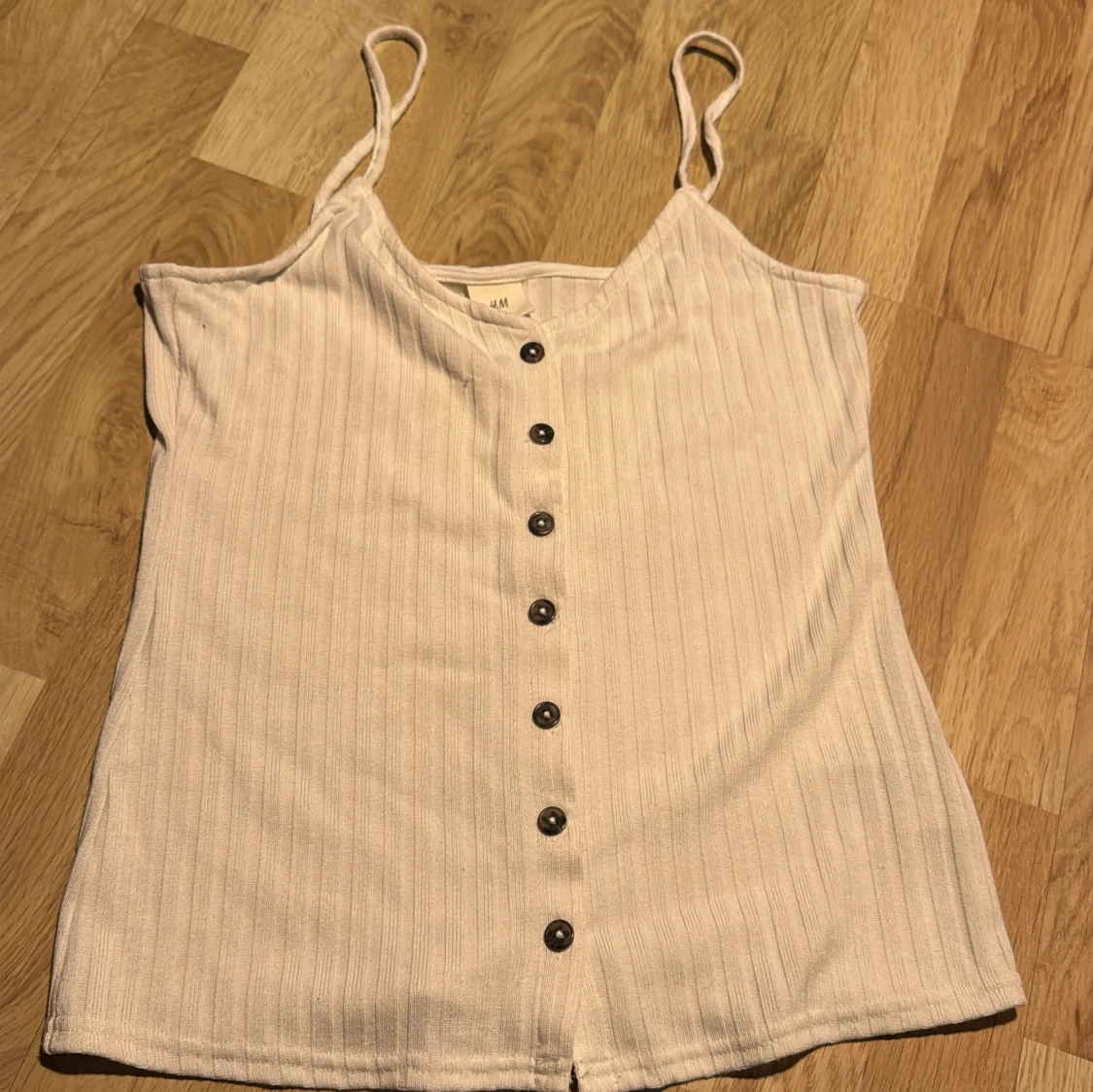 Vit ribbad linnetopp från H&M