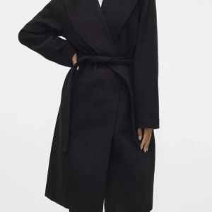 Svart kappa - Väldigt använd men ändå i bra skick 