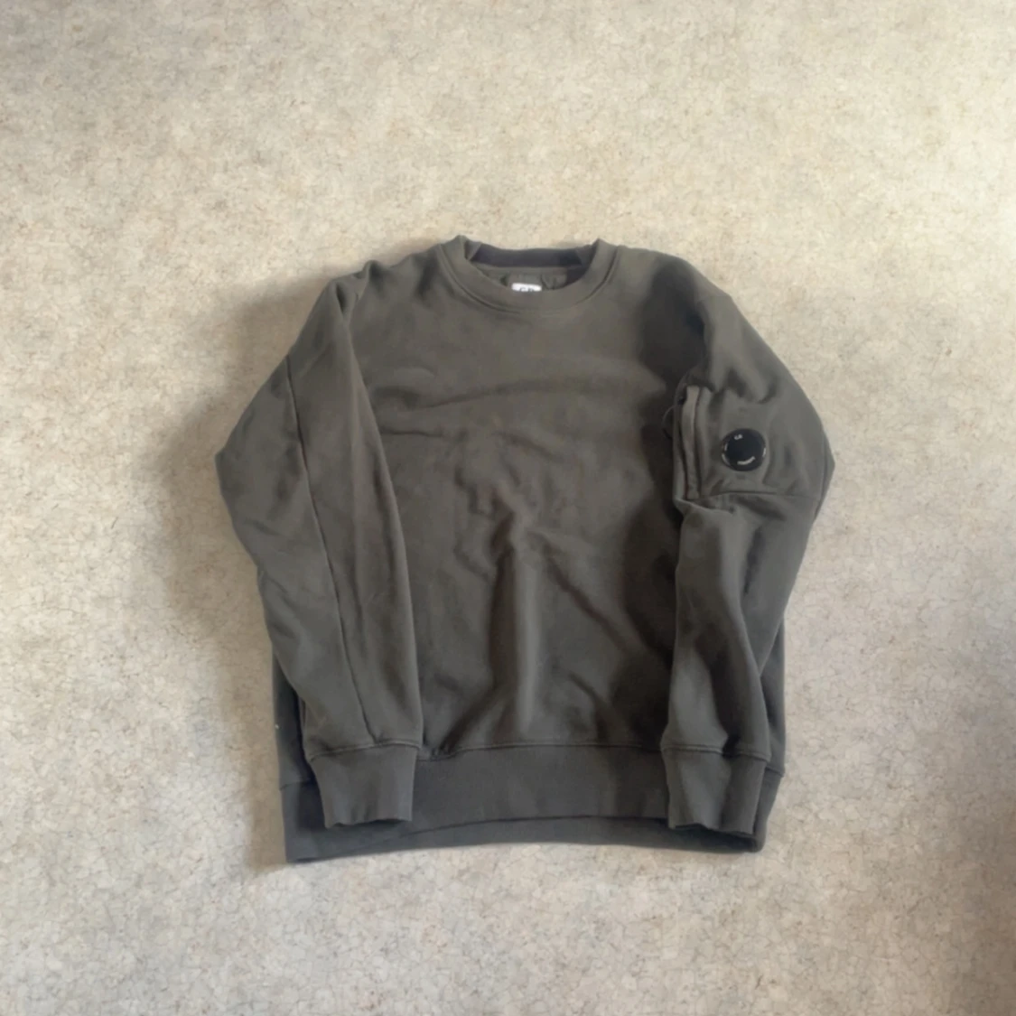 Mörkgrön sweatshirt från cp company